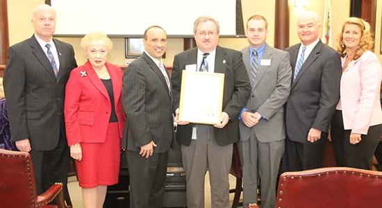 Freeholders Gary J. Rich Sr., Freeholder Lillian G. Burry, Freeholder Director Thomas A. Arnone, Red Cross Director of Disaster Services Tim Settles, Red Cross Disaster Response Specialist Chris Dempsey, Freeholder John P. Curley and Freeholder Deputy Director Serena DiMaso. 